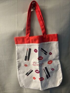Lancôme Paris ,Rouge Lipstick
Kisses Bag